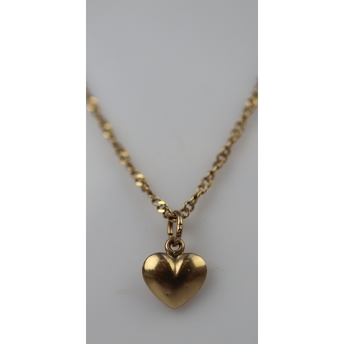 46 - 18ct gold chain with 9ct gold heart pendant- Approx 3g