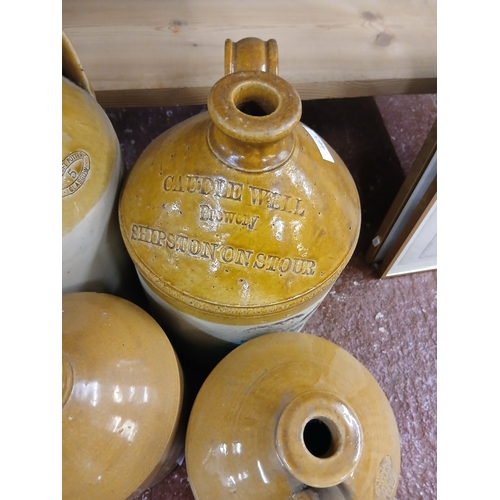 463 - Four stoneware flagons - Height of tallest approx 44cm