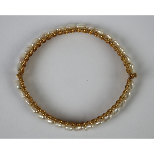 59 - 18ct gold pearl set bangle - Approx 14.1g