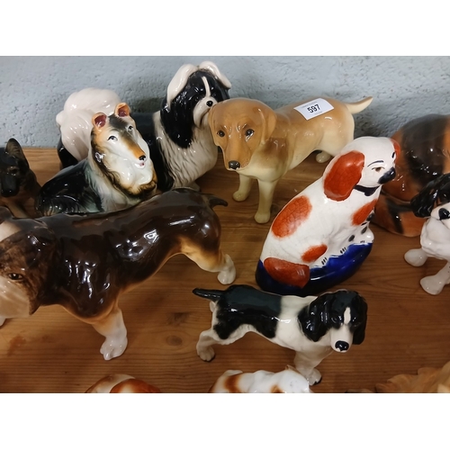 597 - Large collection of ceramic dog figures to include Beswick and Goebel