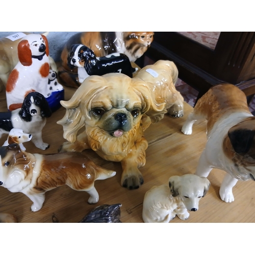597 - Large collection of ceramic dog figures to include Beswick and Goebel