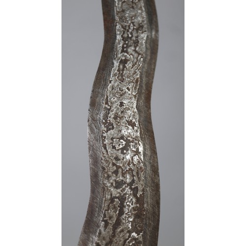 207 - A Javanese Keris (Kris), Indonesia, 19th Century A traditional Javanese keris (kris) with wavy blade... 
