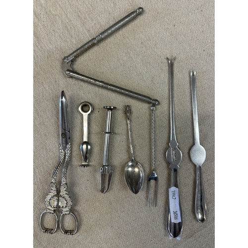 327 - Collection of interesting E.P.N.S and white metal to include nutcrackers, grape scissors, pipe clean... 