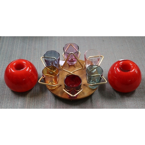 347 - Pair of 1960s orange glass candle holders together with mid century multicoloured shot glasses