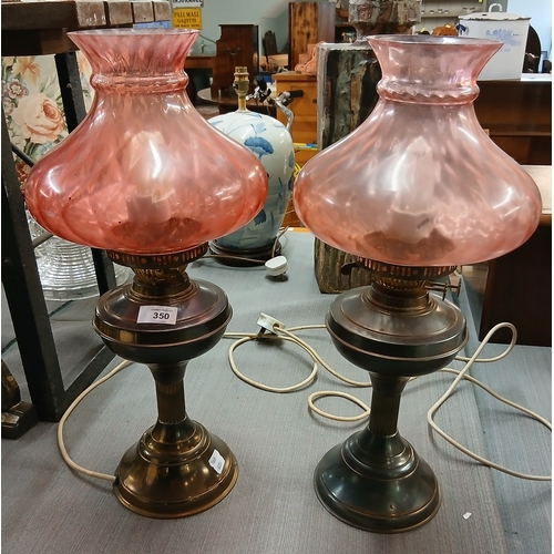 350 - Pair of electric lamps converted from oil lamps with cranberry glass shades - Approx H: 50cm