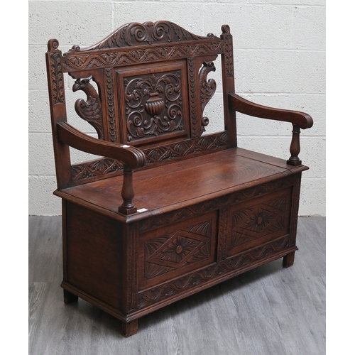 589 - Victorian carved oak settle with lift up lid - Approx W:106cm D:43cm H:104cm