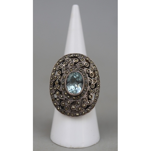 62 - Filigree silver ring set with large blue stone (tests as sapphire)