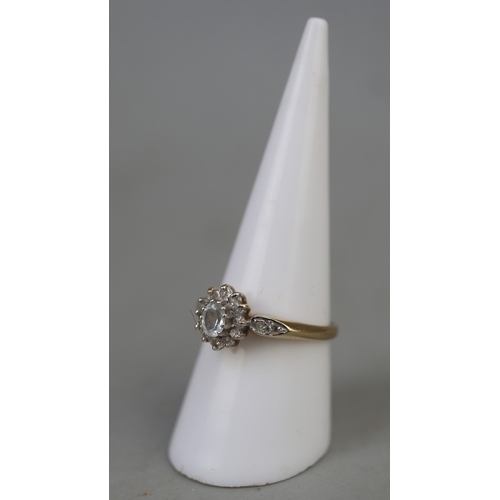 124 - 9ct gold aquamarine and diamond set ring