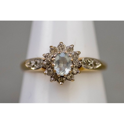 124 - 9ct gold aquamarine and diamond set ring