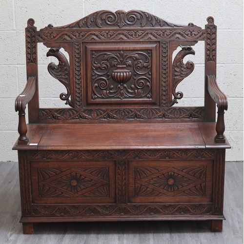 589 - Victorian carved oak settle with lift up lid - Approx W:106cm D:43cm H:104cm
