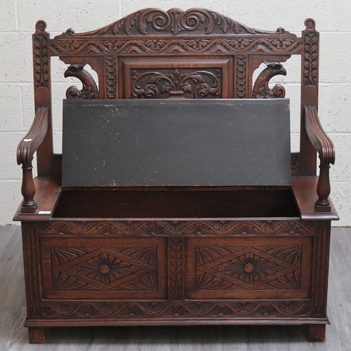 589 - Victorian carved oak settle with lift up lid - Approx W:106cm D:43cm H:104cm