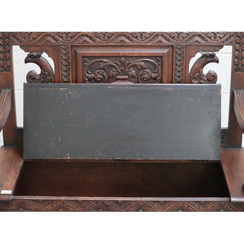 589 - Victorian carved oak settle with lift up lid - Approx W:106cm D:43cm H:104cm