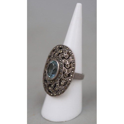 62 - Filigree silver ring set with large blue stone (tests as sapphire)