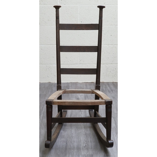 660 - An oak Liberty's style rocking chair