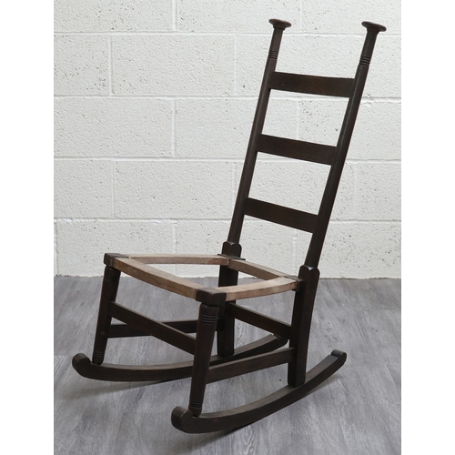 660 - An oak Liberty's style rocking chair
