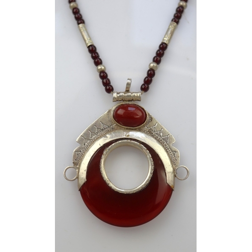 67 - Amber and silver pendant on beaded necklace