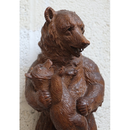 506 - Musical hand Carved wooden Swiss Black Forest Bear with chamois horn coat hooks - Damage to one ear