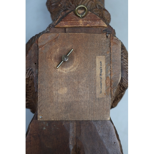 506 - Musical hand Carved wooden Swiss Black Forest Bear with chamois horn coat hooks - Damage to one ear
