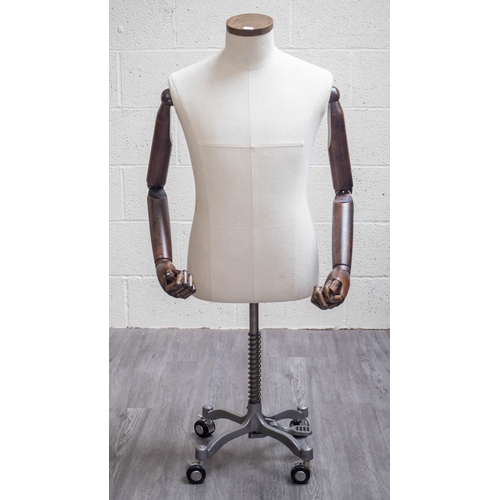 464 - Mannequin with wooden articulated arms, hands and fingers on a wheeled base - Approx H: 120cm
