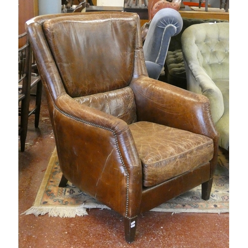 681 - Brown leather armchair