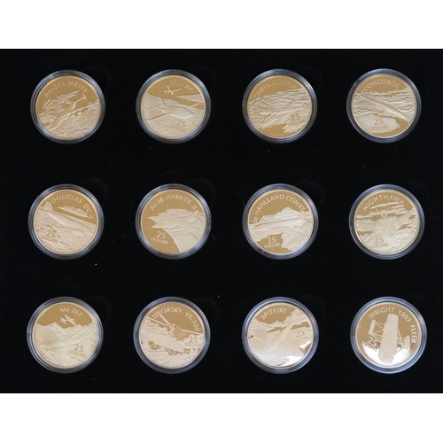 173 - A collection of 12 .999 silver 24ct gold plated Solomon Islands, £25 airplane themed coins, presente... 
