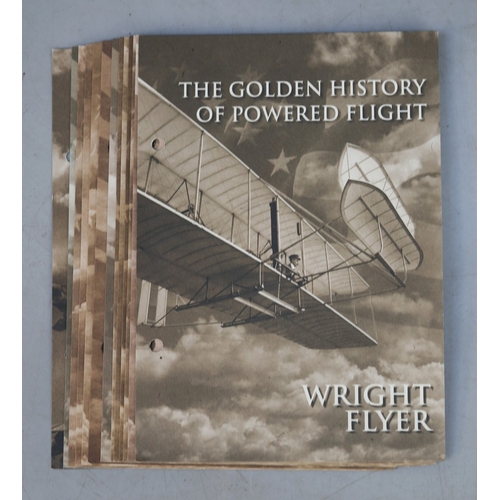 173 - A collection of 12 .999 silver 24ct gold plated Solomon Islands, £25 airplane themed coins, presente... 