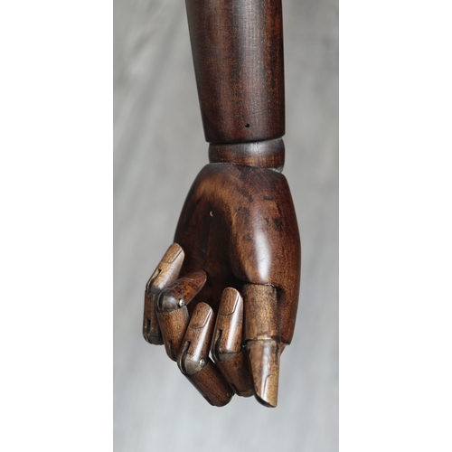 464 - Mannequin with wooden articulated arms, hands and fingers on a wheeled base - Approx H: 120cm
