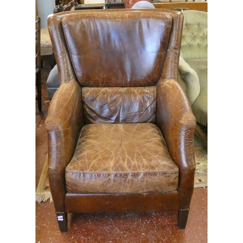 681 - Brown leather armchair