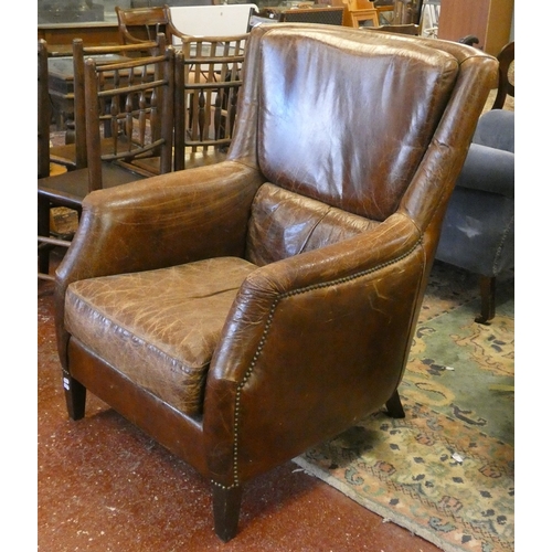 681 - Brown leather armchair