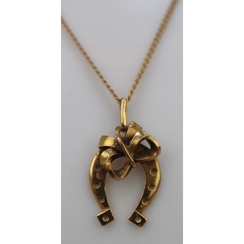 79 - 14ct gold necklace with (possibly 18ct) horseshoe pendant - Approx 5.6g