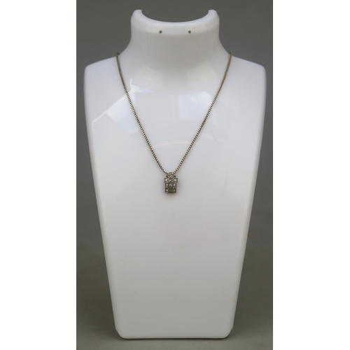 81 - 14ct white gold pendant set with diamonds on 835 silver chain