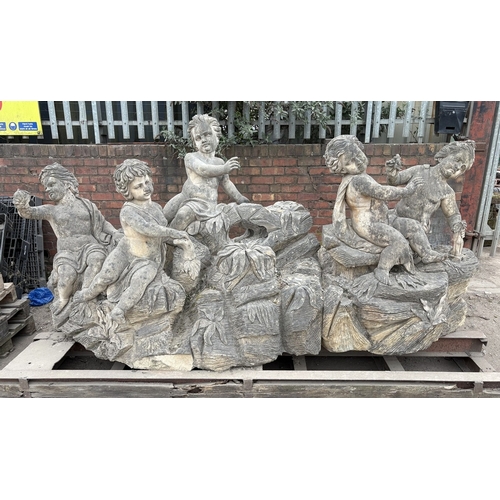 Huge Hand‑Carved Stone Water Feature – Breathtaking bespoke natural stone carving of robed putti on rocks with carved flowers. Approx. 3m long x 1.6m wide x 1.5m tall.