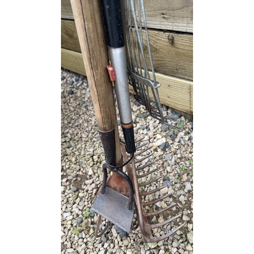 37 - Garden toolset to include lawn rakes, fork, edger, hoe and cultivator