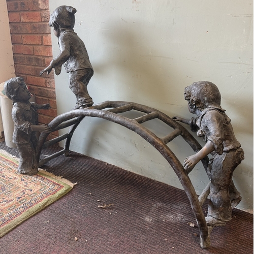 67 - Bronze - A large cast garden sculpture of children playing on a climbing frame - Approx L: 120cm H: ... 