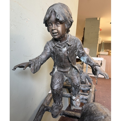 67 - Bronze - A large cast garden sculpture of children playing on a climbing frame - Approx L: 120cm H: ... 