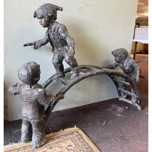 67 - Bronze - A large cast garden sculpture of children playing on a climbing frame - Approx L: 120cm H: ... 