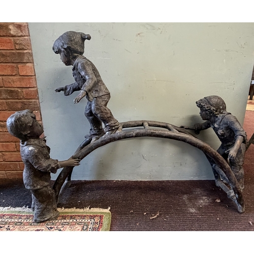 67 - Bronze - A large cast garden sculpture of children playing on a climbing frame - Approx L: 120cm H: ... 