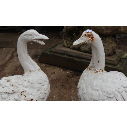 401 - Antique very heavy painted cast iron goose and gander, each approx&nbsp;600mm tall x 56mm wide