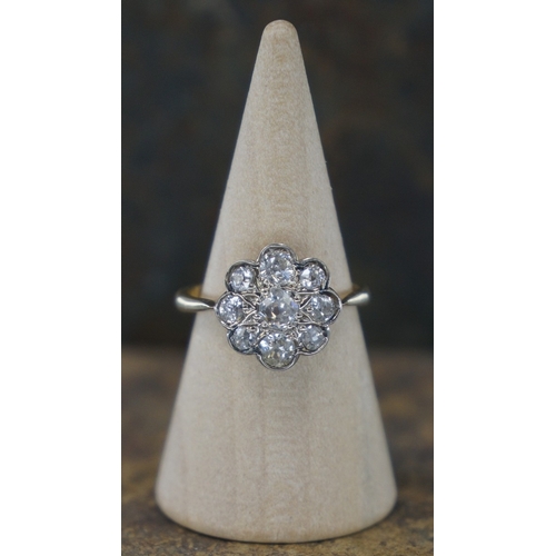 109 - 18ct gold diamond daisy cluster ring with central diamond surrounded by 8 further diamonds together ...