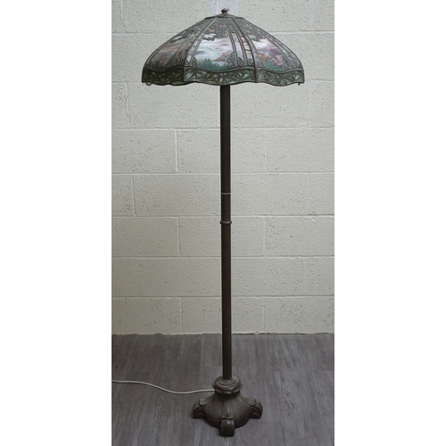 551 - Floor lamp by Handel with pine woods sunset shade, patinated bronze and painted slag glass shade wit...