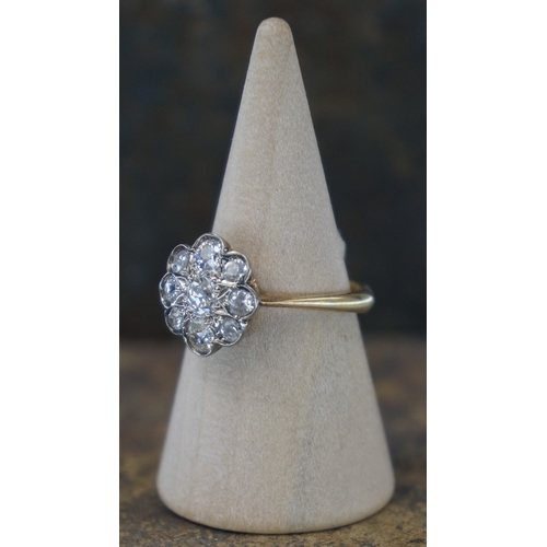 109 - 18ct gold diamond daisy cluster ring with central diamond surrounded by 8 further diamonds together ... 
