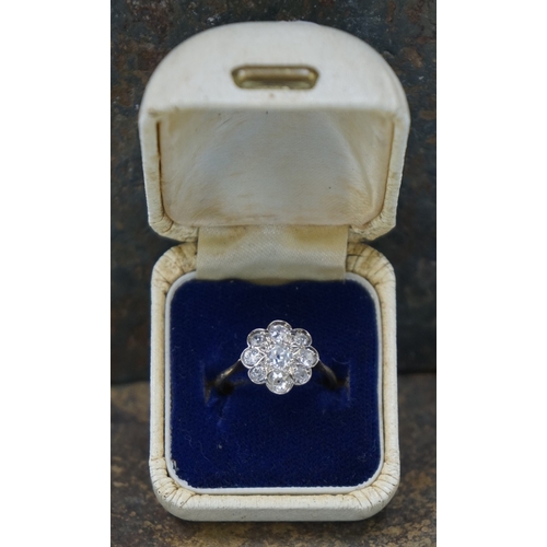 109 - 18ct gold diamond daisy cluster ring with central diamond surrounded by 8 further diamonds together ... 