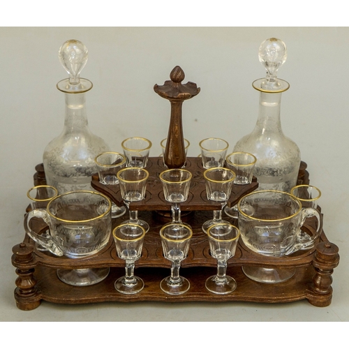 217 - Fine carved Black Forest decanter box complete with original contents - circa late 1800s