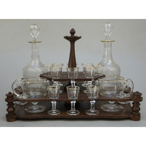 217 - Fine carved Black Forest decanter box complete with original contents - circa late 1800s