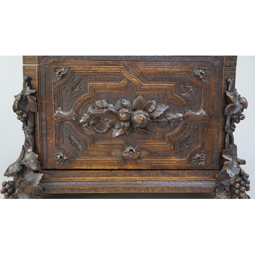 217 - Fine carved Black Forest decanter box complete with original contents - circa late 1800s