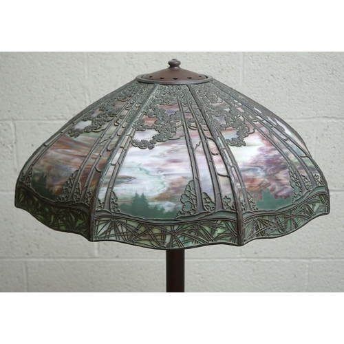 551 - Floor lamp by Handel with pine woods sunset shade, patinated bronze and painted slag glass shade wit... 