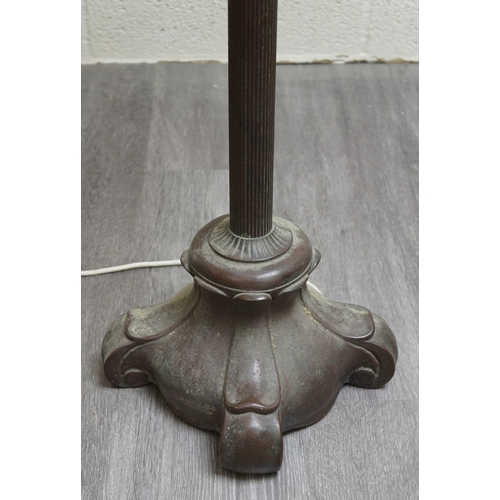 551 - Floor lamp by Handel with pine woods sunset shade, patinated bronze and painted slag glass shade wit... 