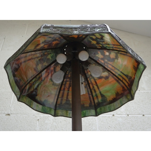 551 - Floor lamp by Handel with pine woods sunset shade, patinated bronze and painted slag glass shade wit... 
