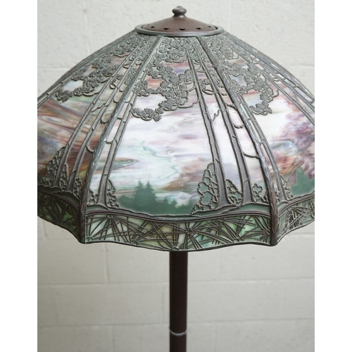 551 - Floor lamp by Handel with pine woods sunset shade, patinated bronze and painted slag glass shade wit... 