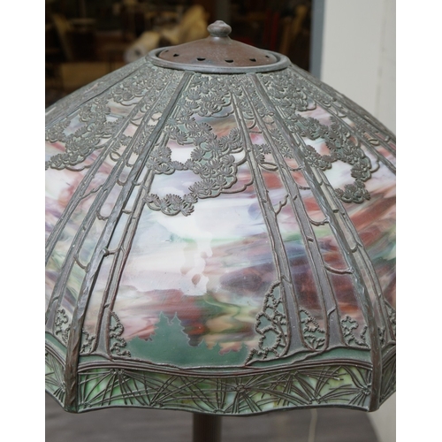 551 - Floor lamp by Handel with pine woods sunset shade, patinated bronze and painted slag glass shade wit... 
